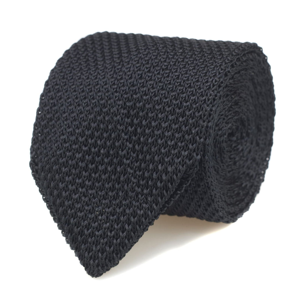 Dark gray knitted tie on a white background