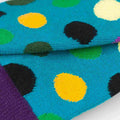 Colorful polka dot fabric with blue background