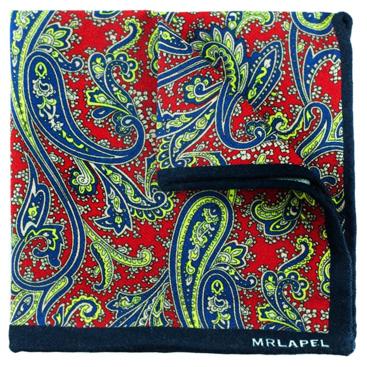 Paisley patterned blanket with red, blue, and green colors on a white background