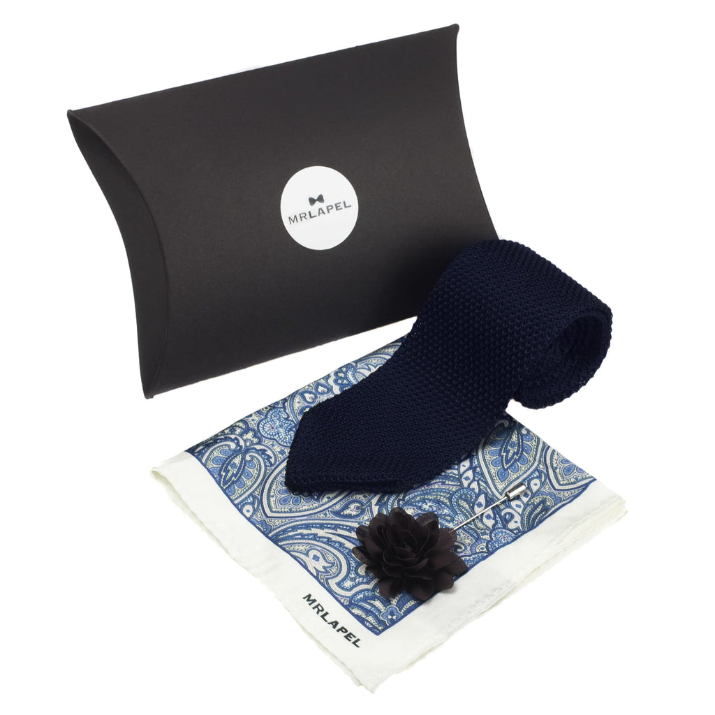 Navy knit tie and patterned pocket square with 'MILAPEL' branding on a white background