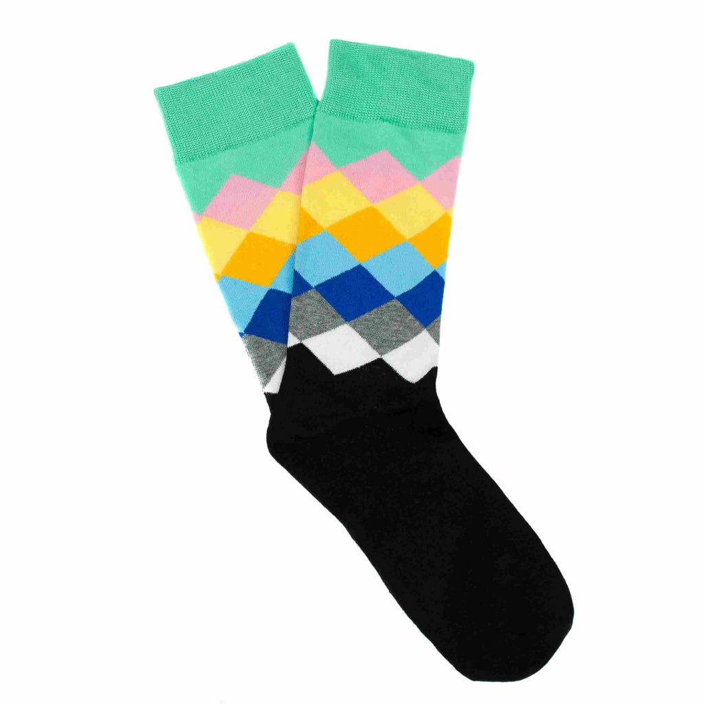 Colorful diamond patterned sock with green cuff on a white background