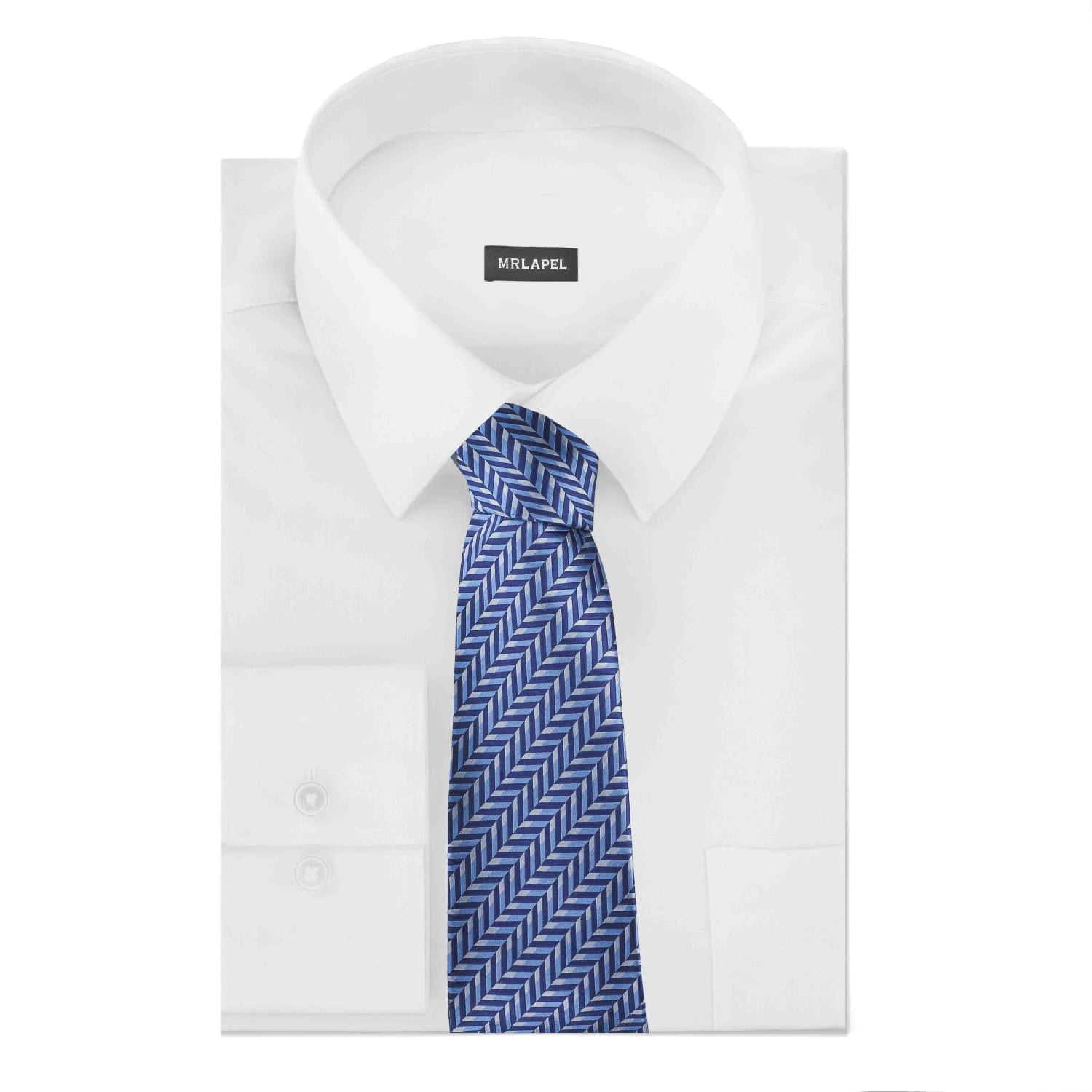 White dress shirt with a blue patterned tie on a white background
