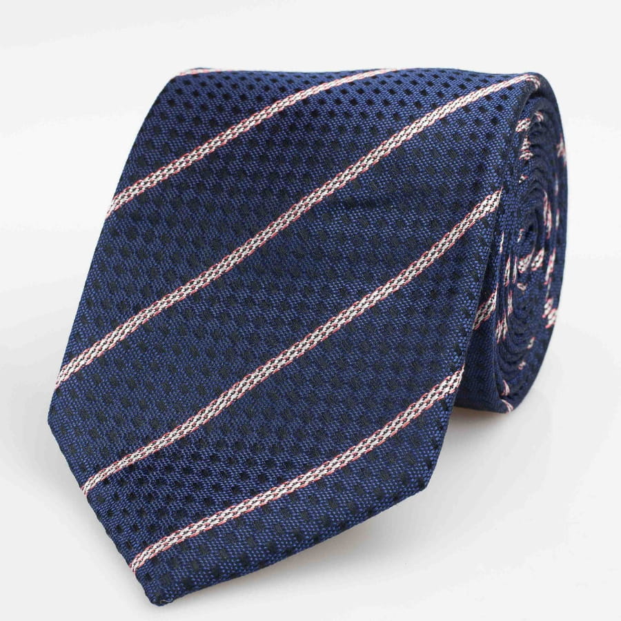 Navy tie with pink stripe shown rolled up against white background