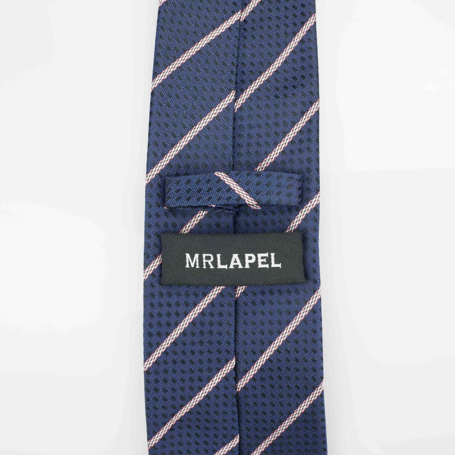 reverse of a navy silk tie with pink diagonal stripes on it