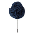Navy blue rose-shaped brooch on a white background