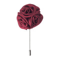 Red rose-shaped lapel pin on a white background