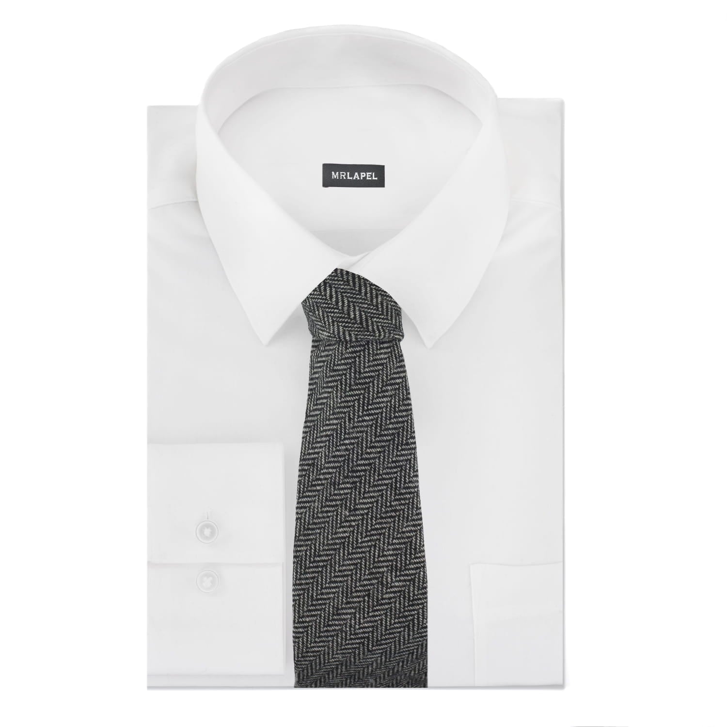 White dress shirt with a black and gray patterned tie on a white background