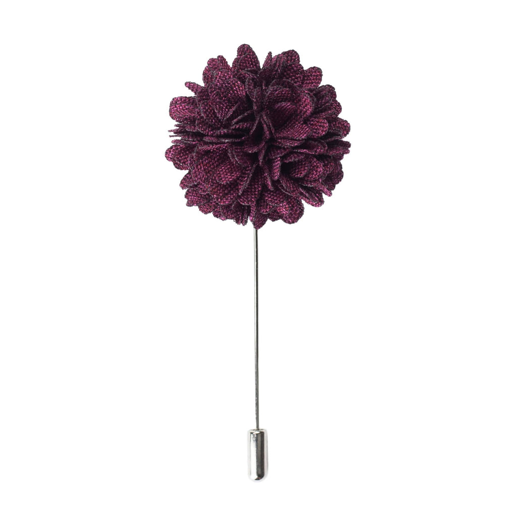 Purple flower-shaped lapel pin on a white background