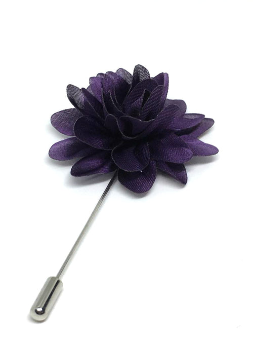 Purple flower lapel pin on a white background