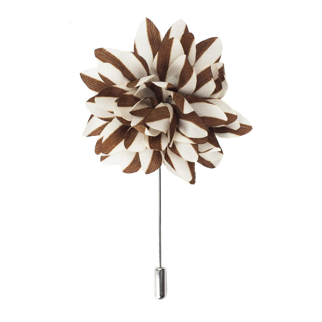 Brown and white floral lapel pin on a white background