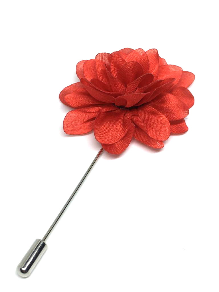 Red flower lapel pin on a white background