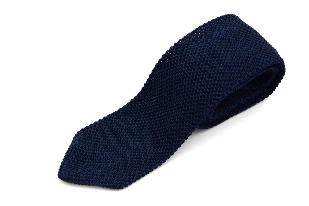 Navy Knitted silk tie on white background