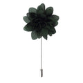 Dark green floral lapel pin on a white background