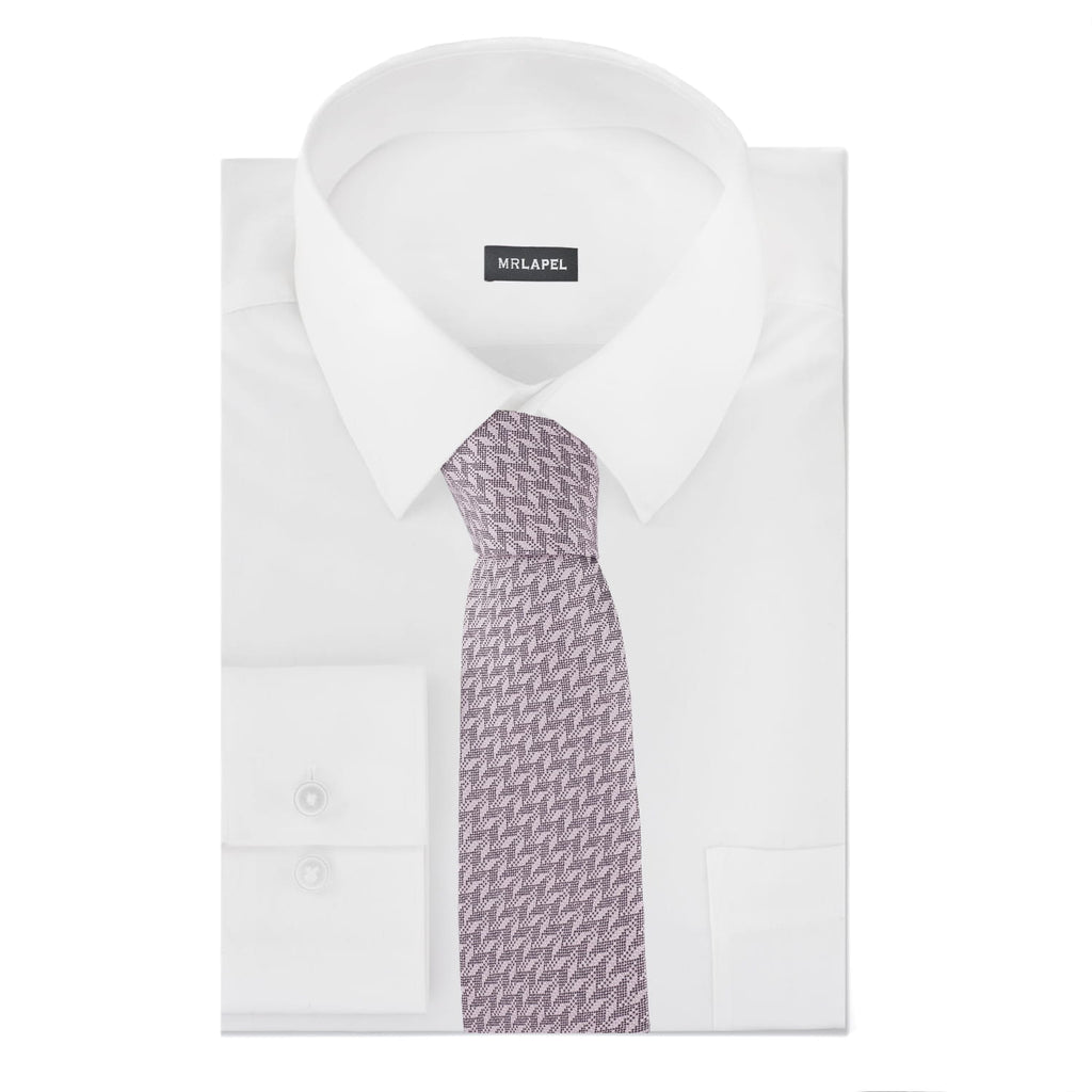 White dress shirt with a patterned tie on a white background