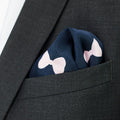 navy and pink pocket square with bow tie pattern