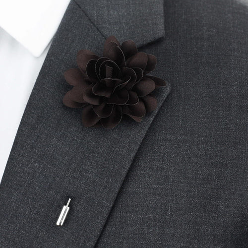 Dark gray suit jacket with a matching flower lapel pin on a white background