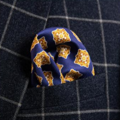 Blue pocket square featuring a printed quatrefoil motif