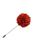 Red flower lapel pin on a white background