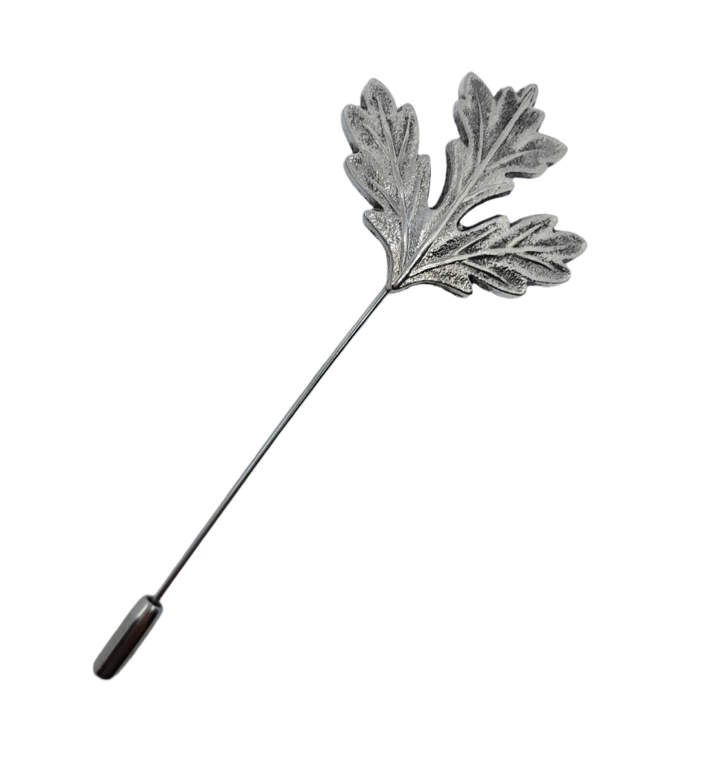 Silver leaf-shaped lapel pin on a white background