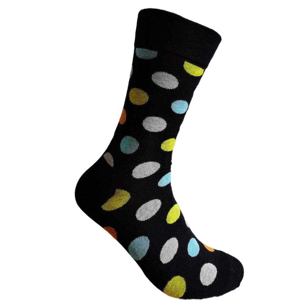 Black sock with colorful polka dot pattern on a white background