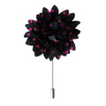 Black flower-shaped lapel pin with pink polka dots on a white background