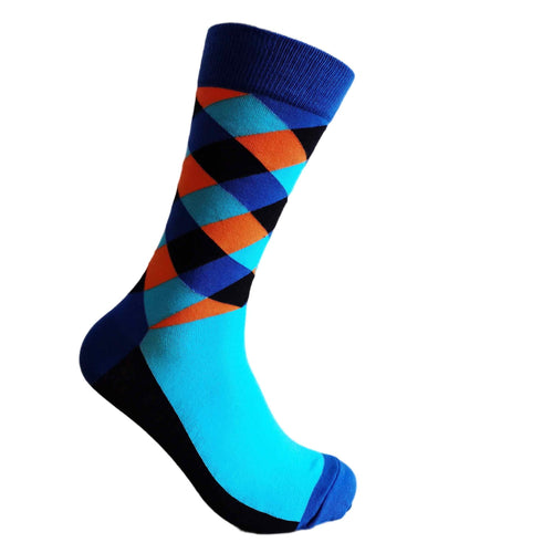 Blue and orange socks on white background