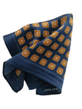 Navy blue pocket square with orange geometric pattern on a white background