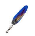 Blue feather with red and yellow feathers laid on top to create unique lapel pin. Photographed against a white background