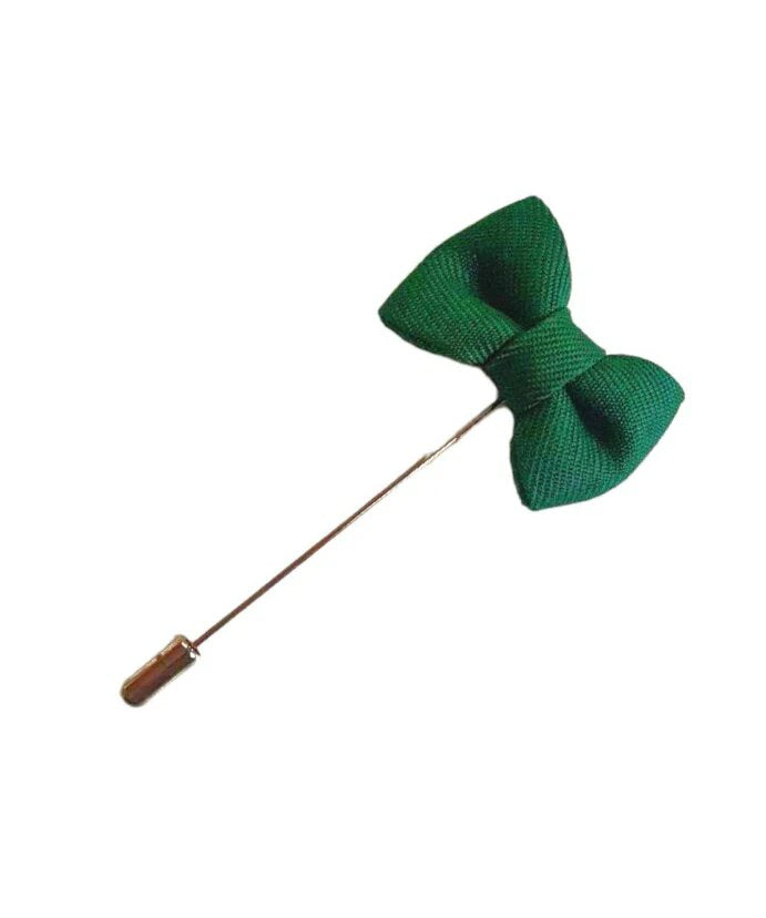 green lapel pin in the shape of a bow tie