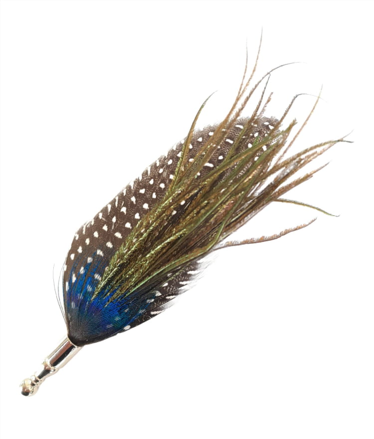 Fishing fly with feathers and a metal hook on a white background
