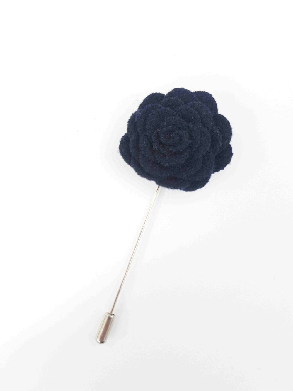 Navy blue flower lapel pin on a white background