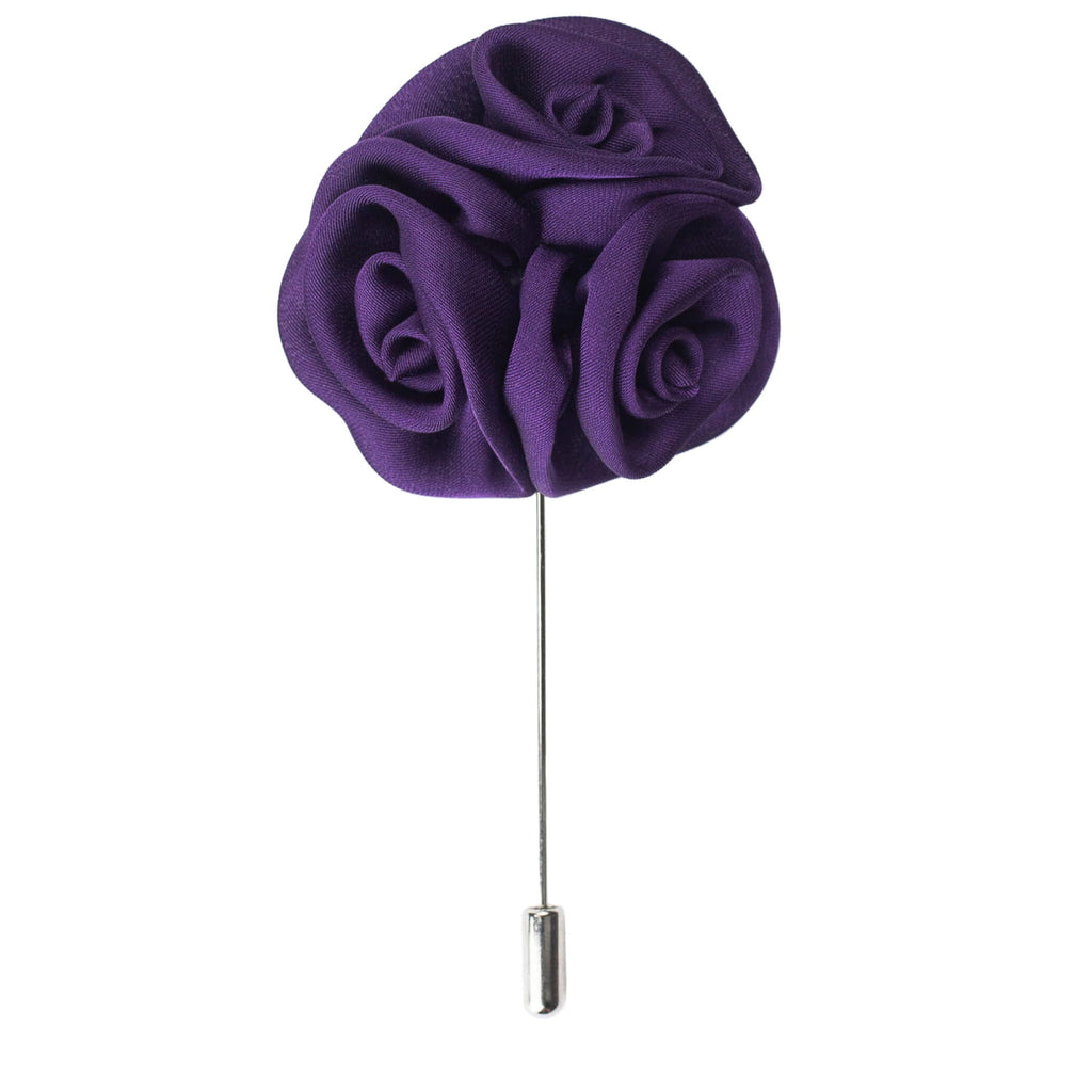 Purple flower brooch on a white background
