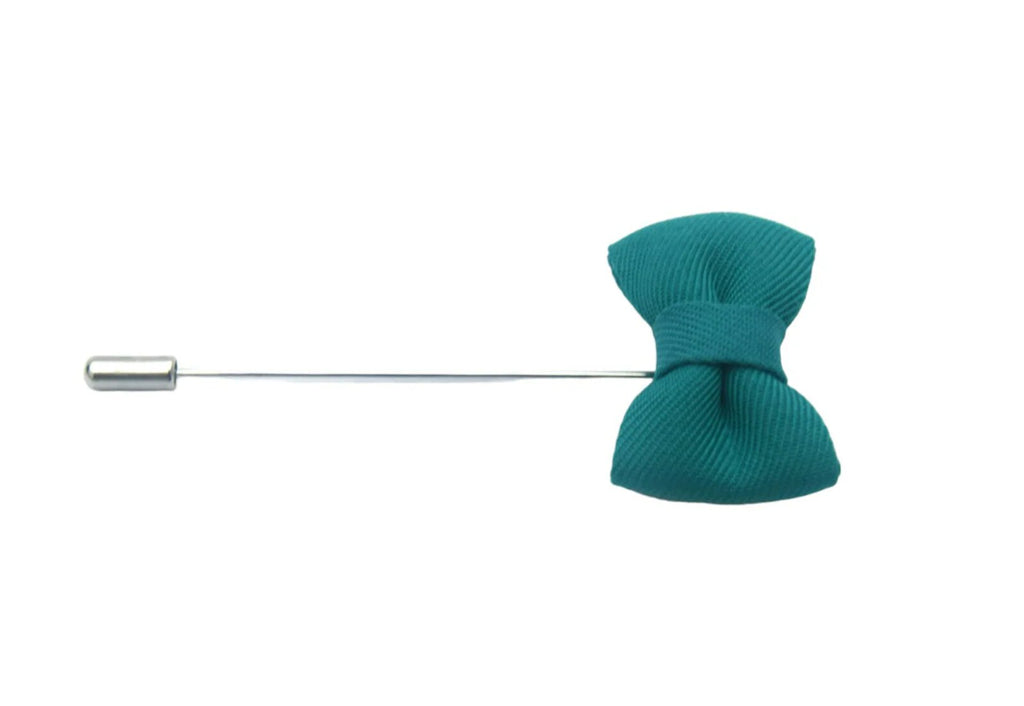 turquoise coloured button hole in the shape of a bow tie