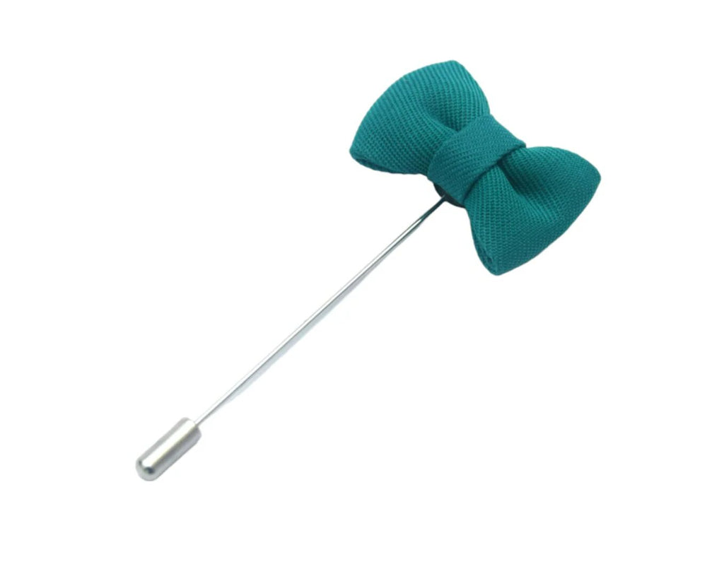 turquoise coloured button hole in the shape of a bow tie