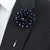 navy and white polka dot lapel pin flower